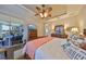 Relaxing main bedroom with a private patio, water view, and luxurious furnishings, offering a peaceful retreat at 1348 Emerald Dunes Dr, Sun City Center, FL 33573