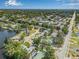 Scenic aerial view of a neighborhood featuring mature trees, a nearby lake, and proximity to urban amenities at 1404 84Th N Ave, St Petersburg, FL 33702
