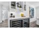 Close-up of bar area with granite countertops, wine storage, and stylish lighting at 1404 84Th N Ave, St Petersburg, FL 33702