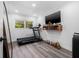 Bright exercise room with a treadmill, hardwood floors, and natural lighting at 1404 84Th N Ave, St Petersburg, FL 33702