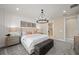 Well-lit primary bedroom featuring modern accents, soft carpet, and ensuite bathroom at 16419 Sapphire Point Dr, Lakewood Ranch, FL 34211