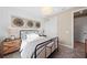 Bedroom features a stylish bed, modern chandelier, and closet at 16419 Sapphire Point Dr, Lakewood Ranch, FL 34211