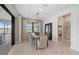 Dining room with modern lighting, neutral tones, and view of the lake at 16419 Sapphire Point Dr, Lakewood Ranch, FL 34211