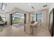 Dining room with scenic views, modern lighting and access to the backyard patio at 16419 Sapphire Point Dr, Lakewood Ranch, FL 34211