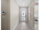 Bright foyer with a glass-panel front door and tile flooring at 16419 Sapphire Point Dr, Lakewood Ranch, FL 34211