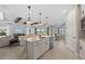 Modern kitchen with a center island open to the living and dining areas, great for entertaining and gatherings at 16419 Sapphire Point Dr, Lakewood Ranch, FL 34211
