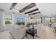 Bright living room featuring coffered ceilings, neutral decor, and view to the outdoors at 16419 Sapphire Point Dr, Lakewood Ranch, FL 34211