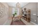 Cozy office features a wooden desk, shelves, and natural light at 16419 Sapphire Point Dr, Lakewood Ranch, FL 34211