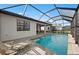 Screened-in pool and deck offer ample space for relaxing and entertaining with lounge chairs nearby at 16419 Sapphire Point Dr, Lakewood Ranch, FL 34211