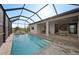 Screened-in pool and deck area features ample space for lounging, dining, and enjoying the outdoors at 16419 Sapphire Point Dr, Lakewood Ranch, FL 34211