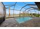 Relaxing screened-in pool with a lake view and lounge chairs provides a perfect outdoor escape at 16419 Sapphire Point Dr, Lakewood Ranch, FL 34211