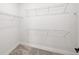 Walk-in closet with wire shelving and carpet flooring at 16419 Sapphire Point Dr, Lakewood Ranch, FL 34211