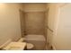 Clean bathroom with a tub/shower combo, white tile surround, and a modern vanity at 1643 Springwell Ln, Sarasota, FL 34240