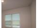Bright room featuring a large window and a neutral color scheme at 1643 Springwell Ln, Sarasota, FL 34240