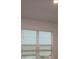 Bright room featuring a large window and a neutral color scheme at 1643 Springwell Ln, Sarasota, FL 34240
