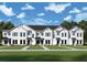 Charming townhome showcasing a white exterior, well-manicured lawn, and inviting curb appeal at 1643 Springwell Ln, Sarasota, FL 34240