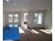 Well-lit living room with three windows offering natural light and providing view of the outdoors at 1643 Springwell Ln, Sarasota, FL 34240