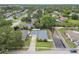 A charming single-story home features a well-maintained lawn and waterfront views at 1812 Teakwood Ln, Dunedin, FL 34698