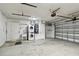 A spacious two-car garage with laundry and ample storage space at 1812 Teakwood Ln, Dunedin, FL 34698