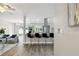 Modern open-concept kitchen with sleek countertops, stainless steel appliances, and bar stool seating at 1812 Teakwood Ln, Dunedin, FL 34698