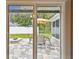 Enjoy outdoor living on the patio, complete with seating, fire pit, and landscaped backyard at 1812 Teakwood Ln, Dunedin, FL 34698