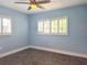 A serene bedroom featuring tile floors, a ceiling fan, and bright windows with shutters at 1818 Douglas Ave, Dunedin, FL 34698