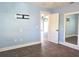 A bright bedroom with modern features, including a wall-mounted TV bracket and stylish mirror at 1818 Douglas Ave, Dunedin, FL 34698