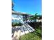 Inviting front entrance with modern walkway, freshly mulched garden and manicured lawn at 1818 Douglas Ave, Dunedin, FL 34698