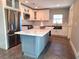 A newly renovated kitchen with stainless steel appliances and a large kitchen island at 1818 Douglas Ave, Dunedin, FL 34698