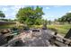 This home has a large backyard, firepit and waterfront view at 18408 Hanna Rd, Lutz, FL 33549