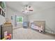 Comfortable bedroom featuring neutral colors and a ceiling fan at 18408 Hanna Rd, Lutz, FL 33549