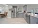 Well-equipped kitchen with modern appliances, plenty of counter space and gray cabinetry at 18408 Hanna Rd, Lutz, FL 33549