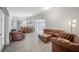 Spacious living room with light-colored floors and a dining area at 18408 Hanna Rd, Lutz, FL 33549