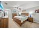 Cozy main bedroom with plush carpet, ceiling fan, and matching dresser and night stands at 18408 Hanna Rd, Lutz, FL 33549
