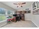 This home office features vaulted ceilings and view of the lake at 18408 Hanna Rd, Lutz, FL 33549