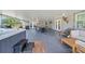 Spacious covered patio with hot tub and multiple seating areas at 18408 Hanna Rd, Lutz, FL 33549