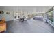 Spacious screened patio with dining set, hot tub, and outdoor lighting at 18408 Hanna Rd, Lutz, FL 33549