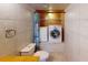 Cozy bathroom with toilet and stacked washer and dryer for added convenience at 1849 Abrico Dr # K9, Lutz, FL 33558