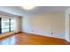 Bright bedroom featuring hardwood floors, large window, and natural light at 1849 Abrico Dr # K9, Lutz, FL 33558