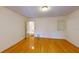 Bedroom with hardwood flooring, white walls, and a doorway to another room at 1849 Abrico Dr # K9, Lutz, FL 33558