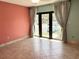 Bright living room with tile floors, neutral paint, and sliding glass doors at 1849 Abrico Dr # K9, Lutz, FL 33558