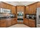 Modern kitchen with ample cabinet space, stainless steel appliances, and stylish backsplash at 20254 Ravens End Dr, Tampa, FL 33647