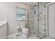 Bathroom with a shower, marble floors, and neutral color scheme is bright and move-in ready at 2042 Craft Ln, Sarasota, FL 34239