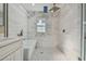 Bathroom with a tub, glass enclosed shower, and modern cabinets is bright and move-in ready at 2042 Craft Ln, Sarasota, FL 34239