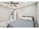 Bright bedroom featuring marble floors, a ceiling fan, and access to the outdoor swimming pool at 2042 Craft Ln, Sarasota, FL 34239