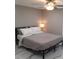 Minimalist bedroom with a queen-size bed, modern lighting, and neutral decor at 2042 Craft Ln, Sarasota, FL 34239