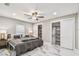 Bedroom featuring marble floors and closet spaces, offering plenty of storage and style at 2042 Craft Ln, Sarasota, FL 34239