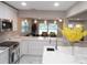Bright, open kitchen with stainless appliances, island seating and great sight lines to living space at 2042 Craft Ln, Sarasota, FL 34239