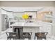 Bright kitchen featuring an island with seating, stainless steel appliances, and ample counter space at 2042 Craft Ln, Sarasota, FL 34239