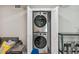Efficient laundry area featuring a stacked washer and dryer, neatly tucked away in a closet at 2042 Craft Ln, Sarasota, FL 34239